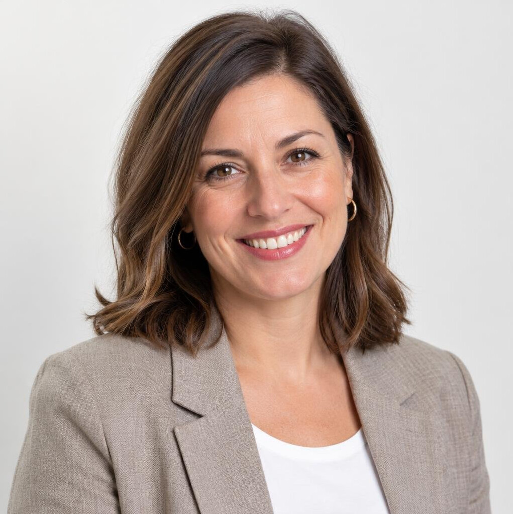 Portrait of a smiling woman editor in a bright office
